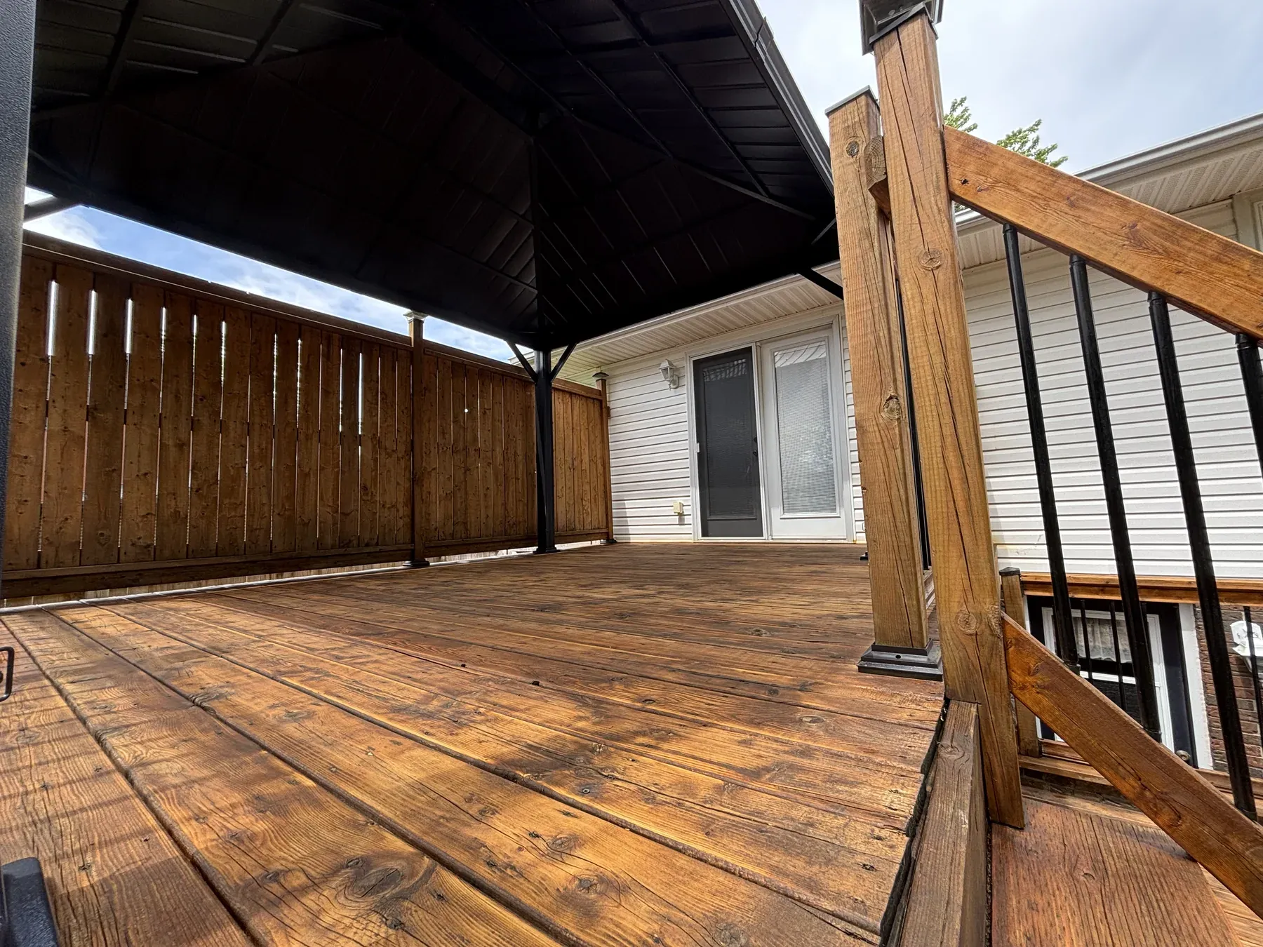 Fort Erie deck — railings and steps detail after maintenance coat