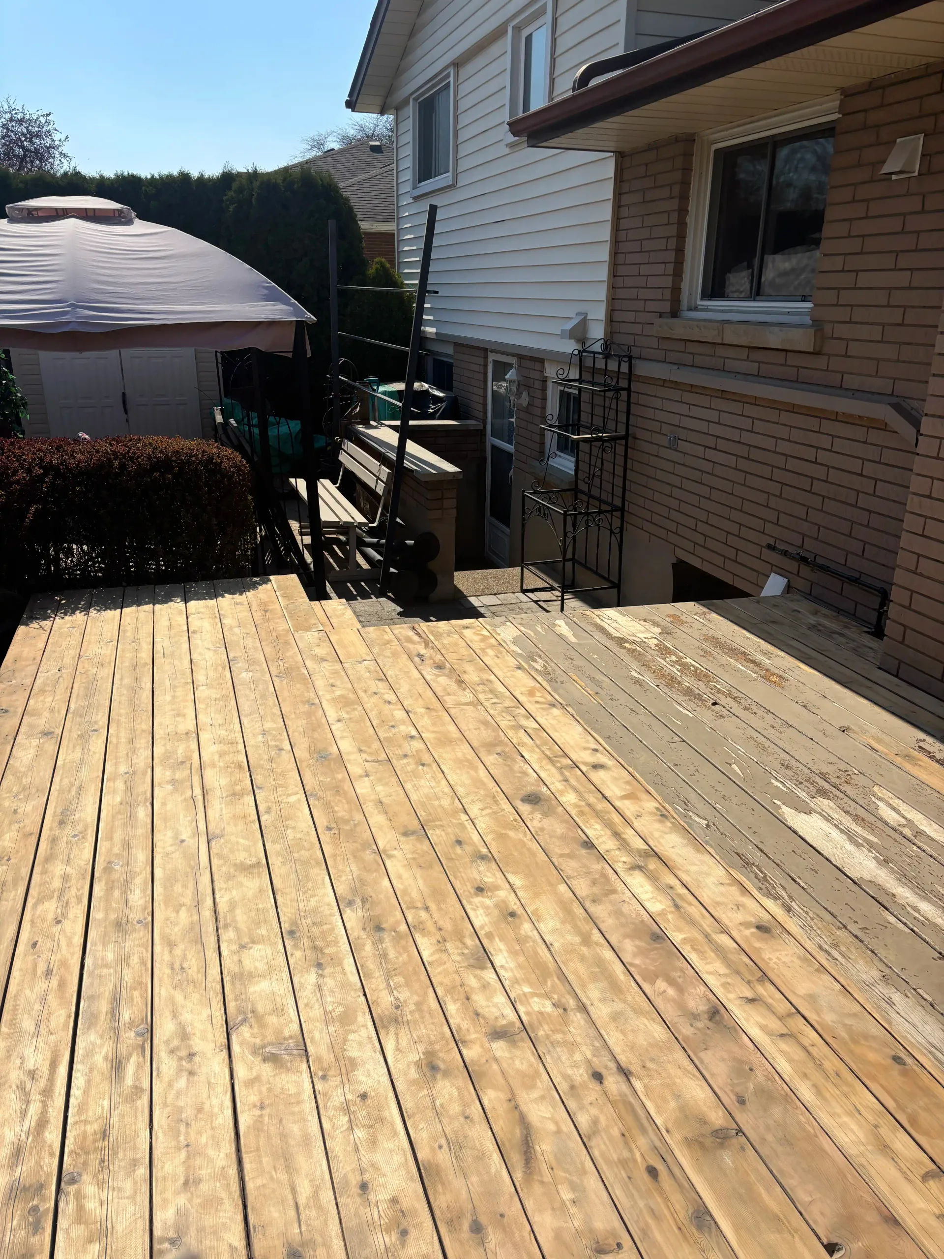 St. Catharines deck — peeling solid stain detail before stripping